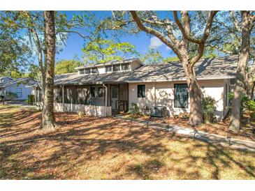 Exterior of a single story home with screened porch at 4804 Lake Ridge Rd # 10, Orlando, FL 32808