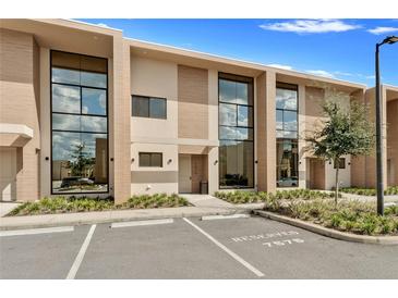 Modern three-story townhome with reserved parking at 7575 Brooklyn Dr, Kissimmee, FL 34747