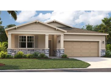 One-story home with stone accents and a two-car garage at 1214 Normandy Dr, Haines City, FL 33844