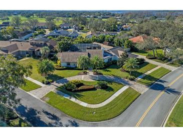 Luxury home with spacious lot, circular driveway, and lush landscaping at 5737 Masters Blvd, Orlando, FL 32819