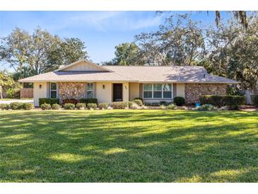 Charming ranch home with stone facade and spacious lawn at 846 Leopard Trl, Winter Springs, FL 32708