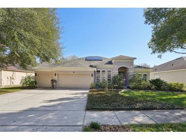 Beautiful two-story home with a three-car garage and solar panels at 2647 Aloma Oaks Dr, Oviedo, FL 32765