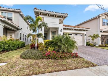 Beautiful home with landscaping, driveway, and two-car garage at 13567 Abberwick Dr, Orlando, FL 32832