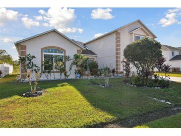Charming single-Gathering home with landscaped front yard and inviting curb appeal on a sunny day at 193 Aurelia Ct, Kissimmee, FL 34758