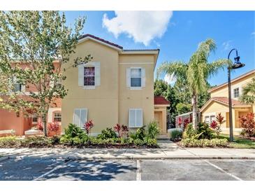 Attractive two-story townhome with landscaping and parking at 4732 Vero Beach Pl, Kissimmee, FL 34746
