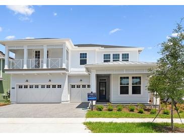 Beautiful two-story home with a three-car garage and eye-catching balcony at 6232 Trailblaze Bnd, St Cloud, FL 34771