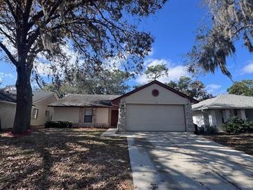 Single story home with attached garage and well-manicured lawn at 512 Holbrook Cir, Lake Mary, FL 32746