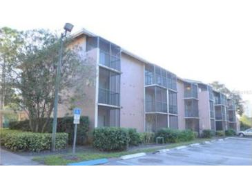 Condo building exterior featuring multiple units and parking at 139 Oyster Bay Cir # 160, Altamonte Springs, FL 32701