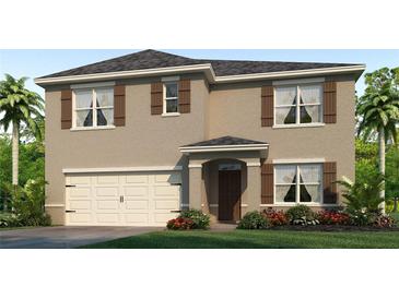 Two-story house with a neutral color exterior, two-car garage, and landscaping at 5079 Tana Ter, St Cloud, FL 34772