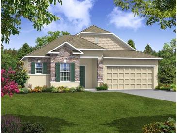 Attractive one-story home with stone accents and a two-car garage at Tbd Ensley Rd, Sorrento, FL 32776