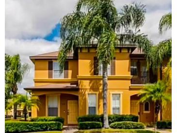 Inviting two-story townhome with attractive landscaping and a welcoming entryway at 538 Terra Lago St, Davenport, FL 33897