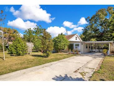 Charming house with a spacious yard, driveway, and lush landscaping at 805 Wingo St, Orlando, FL 32803