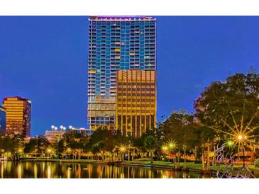 Luxury high-rise building with city and lake views at dusk at 150 E Robinson St # 1411, Orlando, FL 32801