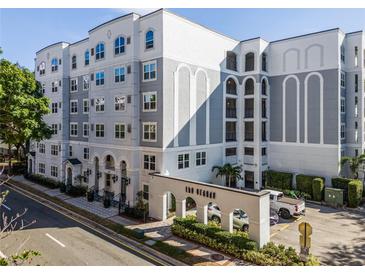 Modern building exterior with parking and landscaping at 206 E South St # 6031, Orlando, FL 32801