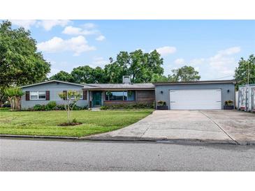 Charming ranch home with a two-car garage and well-manicured lawn at 1792 Killarney Dr, Winter Park, FL 32789