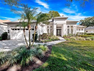 Beautiful one-story home with a two-car garage and manicured lawn at 837 Ashbrooke Ct, Lake Mary, FL 32746