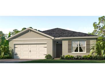 Single-story home with a two-car garage and landscaped front yard at 3540 Sandalwood Isle Way, Ocoee, FL 34761