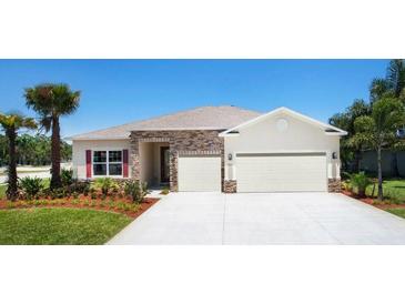 Inviting one-story home with stone accents and a two-car garage at 4940 Lyric Dr, Mascotte, FL 34753