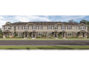 Modern 3-story townhouses with gray siding, gray roofs, and landscaping at 6022 Galloping Dr, Apopka, FL 32712