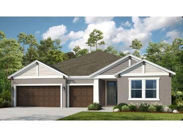 Two-story house with brown double doors and attached garage at 1212 Teal Creek Dr, St Cloud, FL 34769