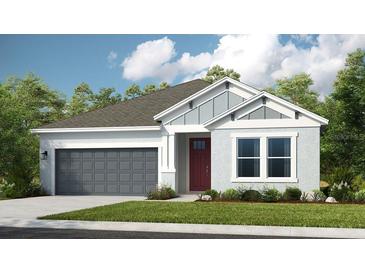 Craftsman style home with gray garage door and red front door at 1218 Teal Creek Dr, St Cloud, FL 34771