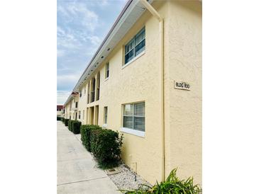 Building 200 exterior features a light yellow building with shrubbery at 211 W San Sebastian Ct, Altamonte Springs, FL 32714