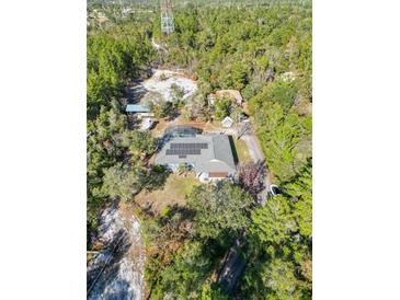 Property overview showcasing the house and surrounding land at 3290 Red Fox Dr, Deltona, FL 32725