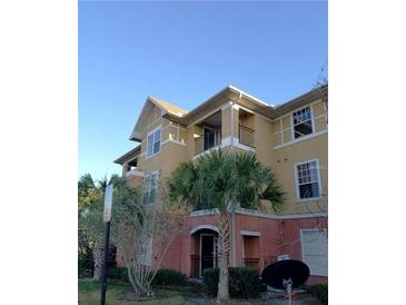 Building exterior featuring attractive architectural details and landscaping at 3700 Castle Pines Ln # 4032, Orlando, FL 32839