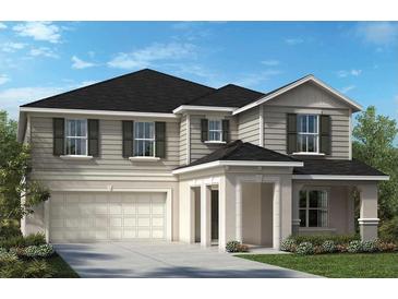 Two-story house with gray siding, dark roof, and a two-car garage at 9676 Westside Hills Dr, Davenport, FL 33896