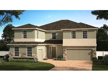 Two-story house with a two-car garage, stone accents, and landscaping at 5867 Sierra Crown St, Mount Dora, FL 32757