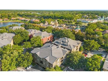 Aerial view of condo community near a lake and shopping at 102 Vista Verdi Cir # 320, Lake Mary, FL 32746