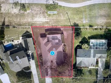 Aerial view of the property showcasing a pool, backyard, and proximity to other homes and greenery at 14101 Vista Del Lago Blvd, Clermont, FL 34711