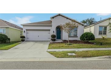 Charming single-story home with a two-car garage, well-manicured lawn, and inviting curb appeal at 2950 Timber Hawk Cir, Ocoee, FL 34761