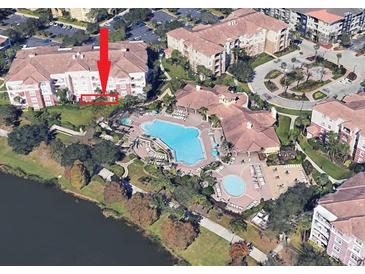 Aerial view of condo community, pool, and landscaping at 5012 Shoreway Loop # 10207, Orlando, FL 32819