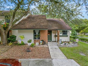 Inviting condo with landscaped front yard and walkway at 194 Post Way, Casselberry, FL 32707