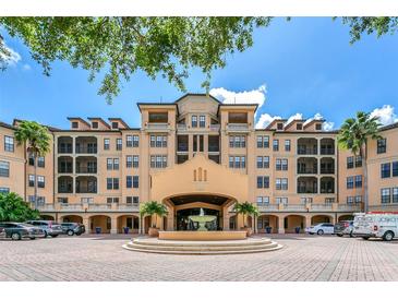 Luxury condo building with fountain and ample parking at 501 Mirasol Cir # 306, Celebration, FL 34747