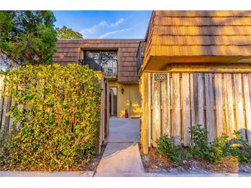 Townhouse exterior featuring a welcoming entrance and the unit number above the door at 5368 Elm Ct # 354, Orlando, FL 32811