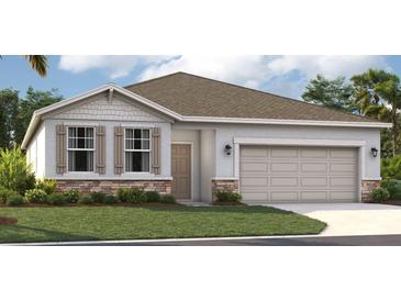 One-story home with a two-car garage and attractive landscaping at 9556 Starling Loop, Leesburg, FL 34788