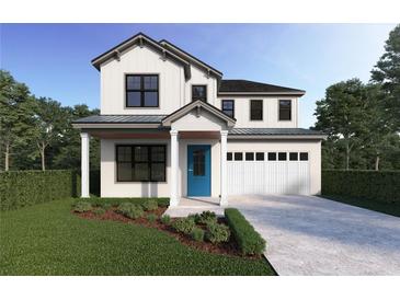 Two-story farmhouse-style home with a blue door and white garage at 2510 Amherst Ave, Orlando, FL 32804