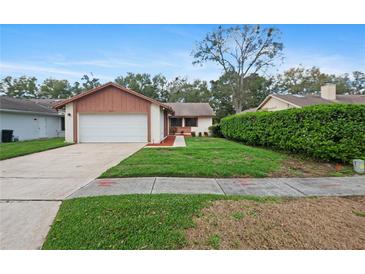 Charming single-story home with attached garage and well-maintained front yard at 654 Boniview Ln, Altamonte Springs, FL 32714