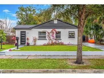 Charming remodeled home with modern exterior and landscaped lawn at 631 Callahan St, Winter Park, FL 32789