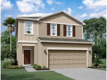 Two-story house with beige siding, brown accents, and a two-car garage at 1457 Dalkeith Cv, Sanford, FL 32771