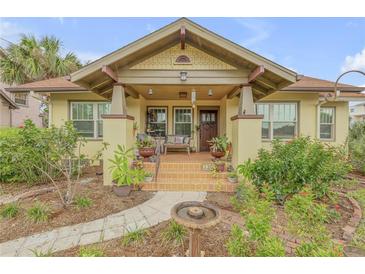 Charming bungalow with a welcoming front porch and beautifully landscaped yard at 220 Riverview Blvd, Daytona Beach, FL 32118