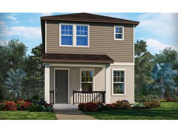 Two-story home with brown siding, dark gray door, and landscaping at 4569 Cross Prairie Pkwy, St Cloud, FL 34772