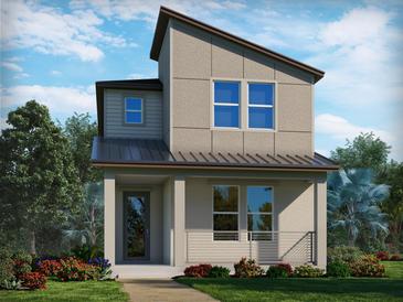 Modern two-story home with a metal roof and landscaped front yard at 4654 Homestead Trl, St Cloud, FL 34772