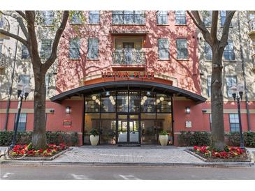 Uptown Place building entrance with modern design and landscaping at 911 N Orange Ave # 214, Orlando, FL 32801