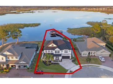 Luxury waterfront home with private dock and expansive lake views at 15863 Burch Island Ct, Winter Garden, FL 34787