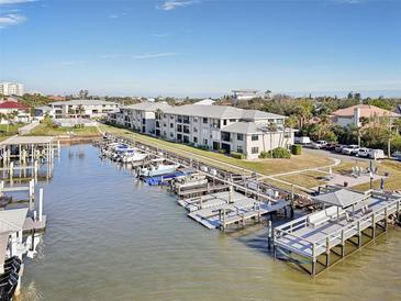 Aerial view of waterfront community with boat slips and resort-style amenities at 2100 N Peninsula Ave # 1030, New Smyrna Beach, FL 32169