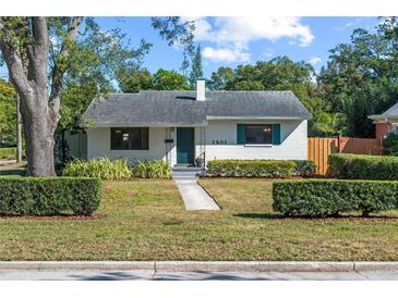 Charming single-story home with well-manicured lawn and updated facade at 2501 Center Ave, Orlando, FL 32806