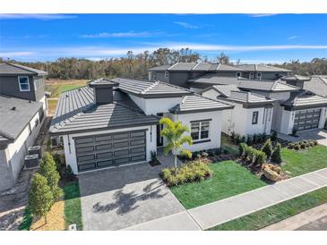 Aerial view of a house and surrounding community at 3032 Kensington Ave, Davenport, FL 33837